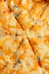 uicy gourmet burger with a fresh tomato slice on top of the bun. Delicious beef patty, melted cheese, lettuce, and vegetables served in a rustic bread bun. Appetizing fast food meal, perfect for lunch