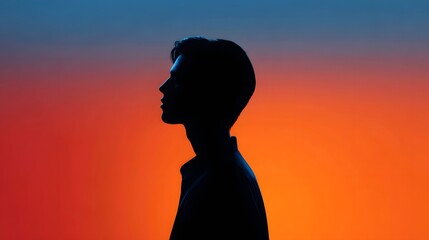 Silhouette of a Thoughtful Man Against a Vibrant Orange and Blue Gradient Background