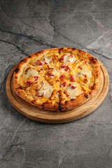 Freshly baked pizza with golden crust, melted cheese, and assorted toppings. Hot and delicious Italian dish served straight from the oven