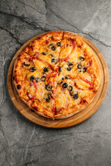 Freshly baked pizza with golden crust, melted cheese, and assorted toppings. Hot and delicious Italian dish served straight from the oven