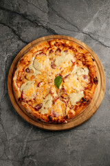 Freshly baked pizza with golden crust, melted cheese, and assorted toppings. Hot and delicious Italian dish served straight from the oven