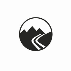 Dramatic mountainscape with winding road enclosed inside a circle silhouette