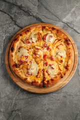 Freshly baked pizza with golden crust, melted cheese, and assorted toppings. Hot and delicious Italian dish served straight from the oven