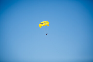 paragliding in blue sky