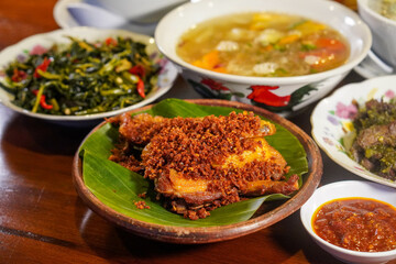 Crispy Fried Kampung Chicken (Free-Range), captured on September 1, 2025. Golden brown Indonesian dish on rustic plate, authentic homemade flavor, traditional culinary heritage