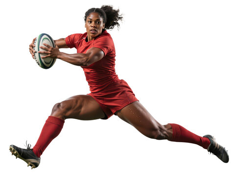 A muscular, dark-skinned woman wearing a red uniform leaps forward, holding a rugby ball with both hands, against a white background.