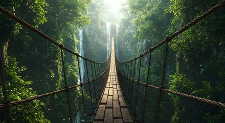 Obraz premium Serene suspension bridge crossing over a lush jungle landscape with cascading waterfalls in the background