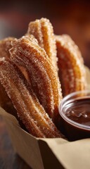 Crispy churros, dusted with sugar, served with chocolate dipping sauce
