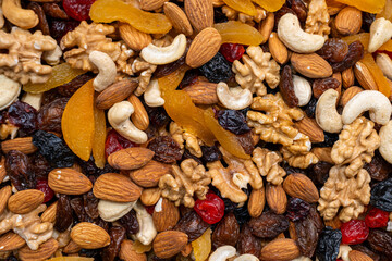 Assortment of Mixed Nuts and Dried Fruits Close-Up © fencifd