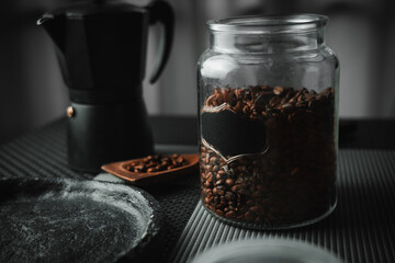 Photo of coffee beans with an Italian coffee maker.