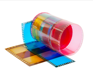 Colorful film roll and negative on a white background photography