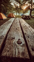 Obraz premium Wooden Picnic Table In Campground At Sunrise