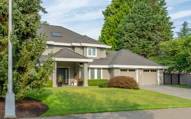 Two story luxury house with beautiful summer  landscape in Vancouver, Canada, North America. Day time on August 2025.