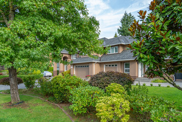 Two story luxury house with beautiful summer  landscape in Vancouver, Canada, North America. Day time on August 2025.
