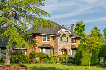 Two story luxury house with beautiful summer  landscape in Vancouver, Canada, North America. Day time on August 2025.