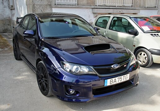Subaru impreza wrx sti parked on a street