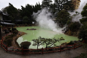 The landscape of Shiraike Jigoku water. One of the beppu hell tour located in snow fall at Beppu,...