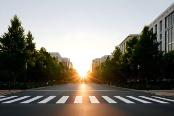 Sunset view down a quiet urban street with crosswalk and trees