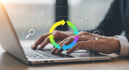 Businessman working on laptop with circular workflow management system