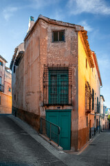 Old house on the corner of a typical street in the old town of Cehegin, Murcia Region, Spain, with colorful facades