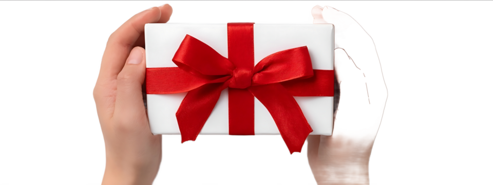 Hands holding a gift box with a red ribbon bow isolated on a white background top view The white present is for a holiday or birthday celebration Concept of