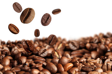 Roasted coffee beans falling onto heap against white background
