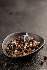 Miniature workers seasoning pepper pea spice tasty snack fresh delicious gourmet food background on the table rustic top view copy space