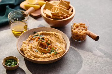 Delicious hummus with olive oil, chickpeas and parsley