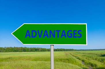 Advantages symbol. Concept word Advantages on beautiful green road sign. Beautiful blue sky green grass and forest peaceful nature background. Business advantages concept. Copy space.