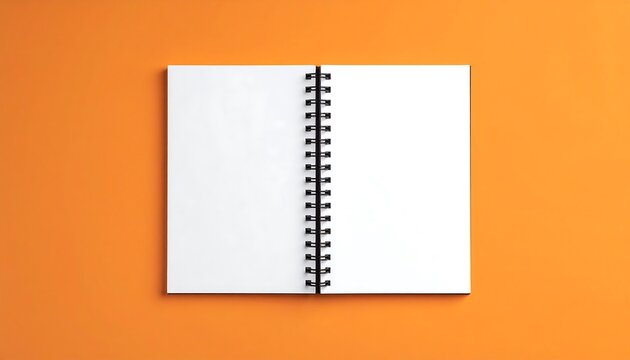 Open spiral-bound notebook on orange background
