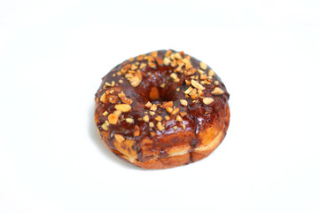 Chocolate Donut with Crushed Nuts on White Background – Sweet Dessert.
