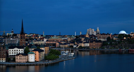 Panorama of the districts Riddarholm and Södermalm at blue hour in Stockholm, Sweden