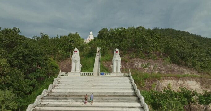 Aerial view Wat Phra That Mae Yen, an ancient temple that has been a symbol of Pai for a long time. Phra Phuttha Lokuttara Mahamuni, a large white Buddha statue in the Mara-Vijaya attitude on hilltop