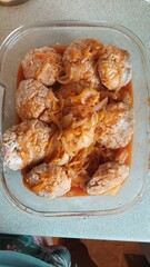 homemade meatballs with frying, in a glass dish for baking in the oven