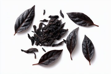 Dark tea leaves and black leaves on white background