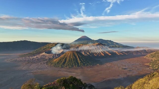 Aerial view fly back over kingkong hill to reveal Bromo volcano, Indonesia 
