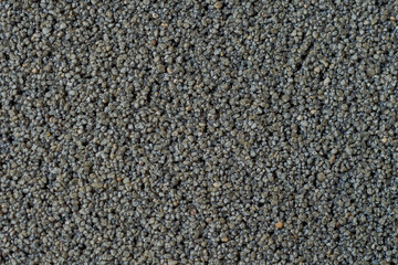 細かい小石の壁面のクローズアップ。背景・テクスチャ素材