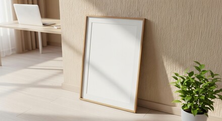 Minimalist interior scene with a blank picture frame laptop and potted plant.
