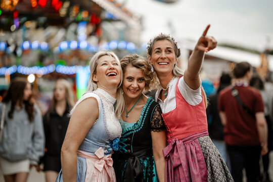 Bavarian heritage is celebrated by women in traditional dirndl costumes at folk festivals such as Munich Oktoberfest G&auml;ubodenvolksfest Straubing and Dultfest