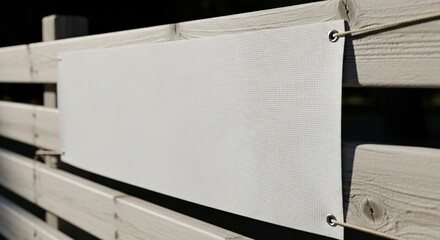 Blank White Mesh Banner Sign on Light Wooden Fence.