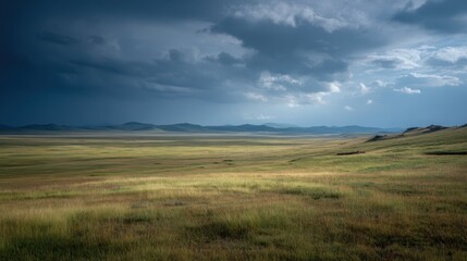 Fototapeta premium Dramatic Stormy Sky Over Grassy Plain in Distant Landscape