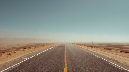 Fototapeta premium Long Straight Desert Highway with Heat Haze and Clear Blue Sky
