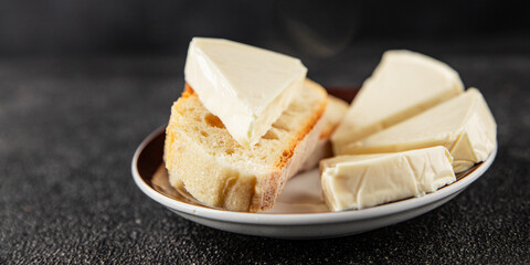Processed cheese spread portion size cheese for sandwich tasty snack fresh delicious gourmet food background on the table rustic food top view copy space