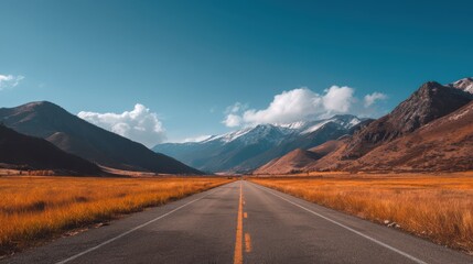 Fototapeta premium Scenic Open Road Disappearing Into Majestic Mountains Landscape