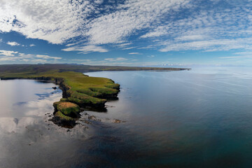 view of the coastline and Manarbakki Peninsula near Husavik in northern Iceland