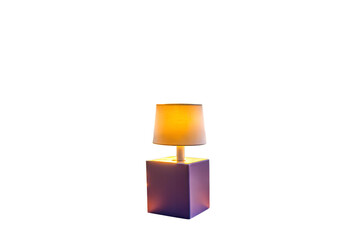 Small illuminated table lamp isolated on white background
