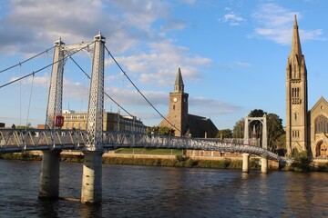 The River Ness, Greig Street Suspension Bridge, and Old High Church, Inverness.
