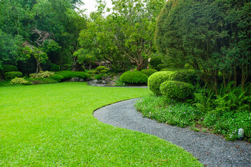 Garden landscape design with pathway in garden and footpath in picturesque summer park and staircase in backyard,Paving stones on floor in park,space for text.