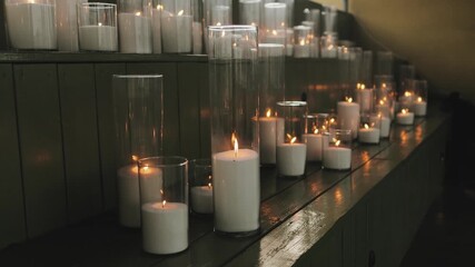 A calming array of candles creates a soothing ambiance, promoting tranquility and thoughtful introspection