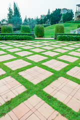 Walkway pathway s curve in public park,Lawn with curved paved garden path,Garden landscape design in flower garden,Selective focus,copy space.